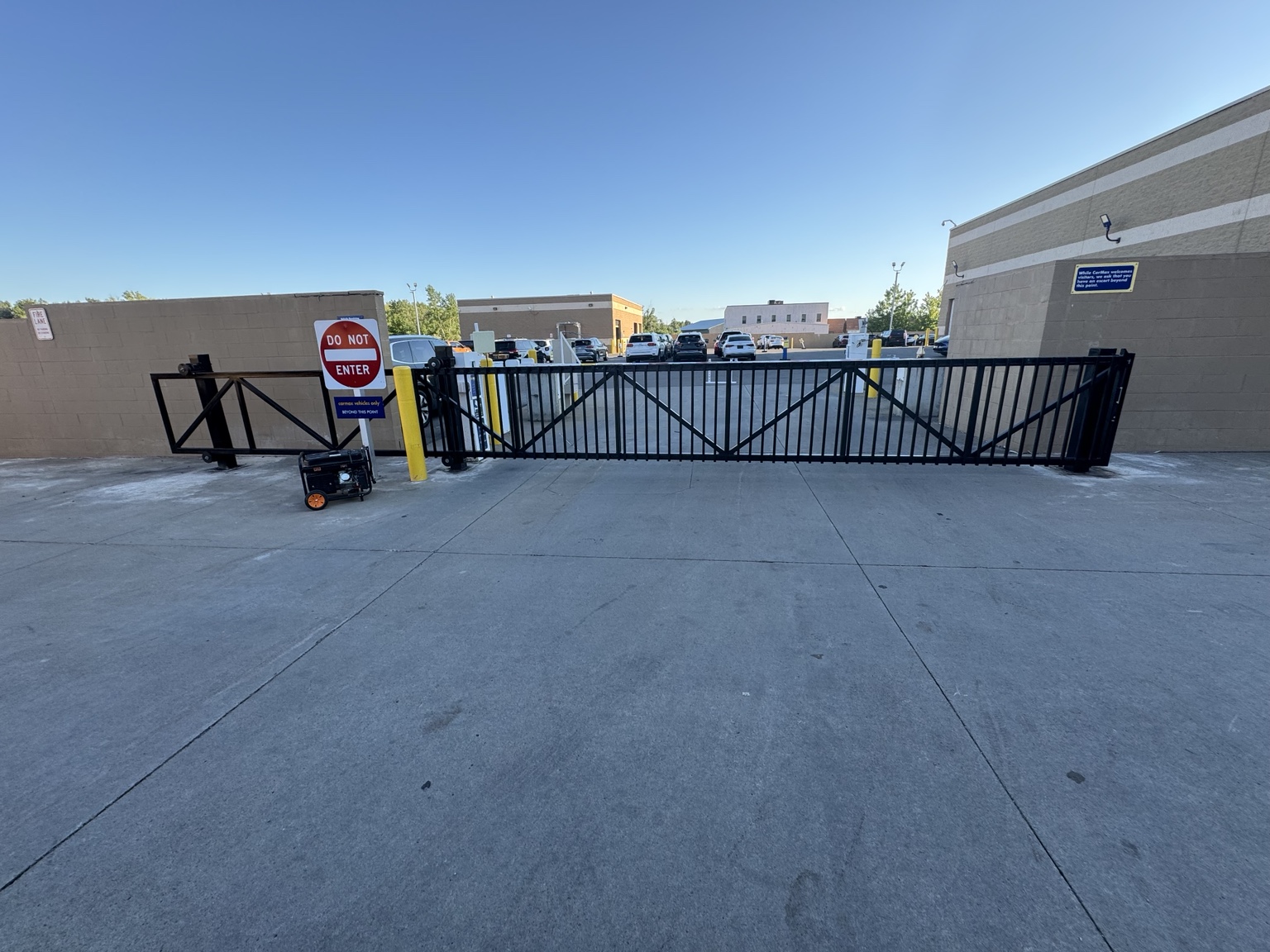 Black steel sliding gate built by Liquid Heat